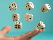 © Ardhana - Hand tossing six ivory dice against a teal background.
