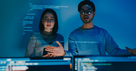 Group adult Asia male female software developers mentor leader manager talk strategy plan to executive write prompt AI bot IT app program nomad, video game, data center. Projecting slideshow code.