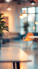 Poster - White table with plant and blurred background in modern cafe interior with warm lights and large windows