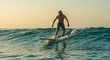 © Gustavo Alves - Dynamic and ultra-realistic AI-generated surf scene featuring a surfer riding a powerful wave, ocean spray, golden sunlight, and cinematic motion – high-quality action shot.