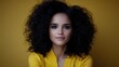 © Konstiantyn Zap - Portrait of young hispanic female with curly hair in yellow outfit