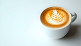 cappuccino with a leaf pattern in a white cup