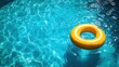 © AuraArt - Yellow inflatable ring floats in a refreshing pool.