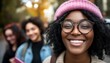 © lisa - Smiling woman wearing glasses with friends enjoying outside together
