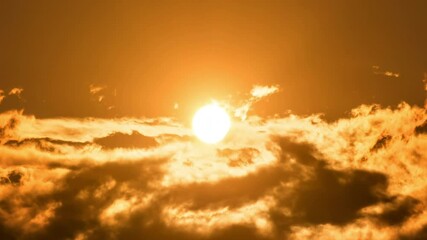 Wall Mural - timelapse of dramatic sunrise with orange sky in a cloudy day.