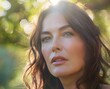 © Deep Stock - Portrait of a Beautiful Brunette Woman with Green Eyes in a Sunny Outdoor Setting