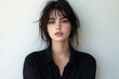 © Basileus - Portrait of a striking young woman with dark hair