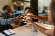 © bernardbodo - Friends toasting with water at restaurant table