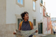 © bernardbodo - Tourist exploring lisbon using a map and looking around