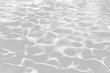 © Delphotostock - Real water ripples texture, sun reflections swimming pool water pattern overlay, isolated on white or transparent background png cut out