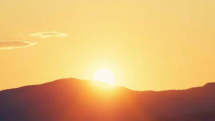 Sticker - Vibrant Sunlight Glowing Over Mountains At Sunset. Wide Shot