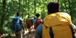 © Lila Patel - Rear View of Hikers on Forest Trail