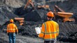 © abangaboy - Engineers Overseeing Coal Mining Operations with Heavy Machinery in the Background