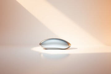 Wall Mural - Sleek futuristic object on a white surface with soft lighting