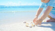 © ppearlgrey - child playing with seashells on sunny beach, enjoying ocean view