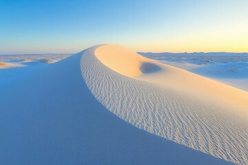 Aufkleber - Serene sunset illuminates a majestic sand dune, its smooth curves and textures showcased in soft, warm light.