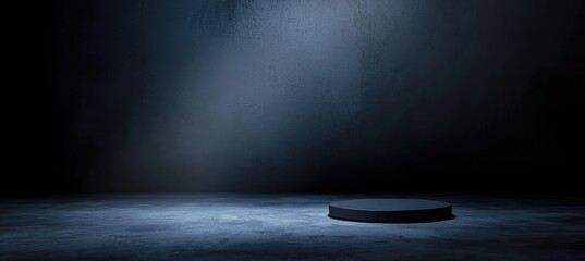 Aufkleber - Spotlight illuminating empty black podium on concrete floor in dark room