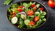 © Олег Чуприна - Fresh salad bowl featuring mixed greens and cherry tomatoes with cucumber slices and sunflower seeds served in a rustic bowl