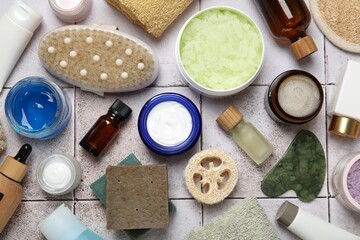 Wall Mural - different body care products on light tiled table, flat lay