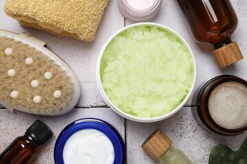 Wall Mural - different body care products on light tiled table, flat lay