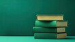 © youthe - Green books stacked, dark green background, education concept, website banner