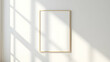 © Gustav - Minimalist blank white frame mockup on a white wall with sunlight shadow overlay, perfect for showcasing artwork and designs in a simple setting