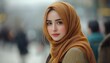 © Rian - A beautiful woman wearing a hijab looks directly at the viewer