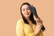 © Pixel-Shot - Beautiful young woman with bouquet of lavender flowers on beige background