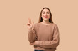 © Pixel-Shot - Young deaf mute woman using sign language on beige background