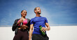 © peopleimages.com - Outdoor, thinking and couple with fitness, water bottle and confidence with break, wellness and challenge. People, man and woman in city, exercise and training with workout, hobby or space with sky