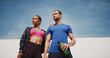 © peopleimages.com - Outdoor, thinking and couple with fitness, relax and confidence with hobby, wellness and challenge. People, man and woman in city, exercise and hydration with workout, training and bonding together