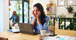 © peopleimages.com - Remote work, headache and woman in cafe with stress, sick or overwork with burnout on laptop. Migraine, tired and person in coffee shop with pain, fatigue and freelancer massage temples for brain fog