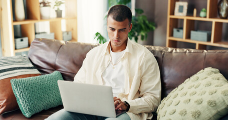 Fototapete - Home, student and man on sofa with laptop for online research, studying and elearning for college. Remote work, school and person on computer for project, assignment and education for university
