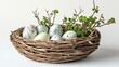 © Marry93 - A rustic Easter basket filled with pastel eggs and fresh green budding twigs, isolated on a white background