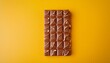 © Ava - mykolaiv ukraine january 14 2021 snickers chocolate bar on yellow background