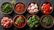 © Dass - Assorted cooking ingredients in small bowls on dark background, ready for meal preparation
