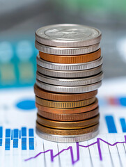 Poster - Stack of coins standing on financial charts showing growth