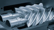 © Aleksandr Matveev - Silver gear with a pointed end and a spiral shape. The spiral shape is very sharp and the gear is very shiny.