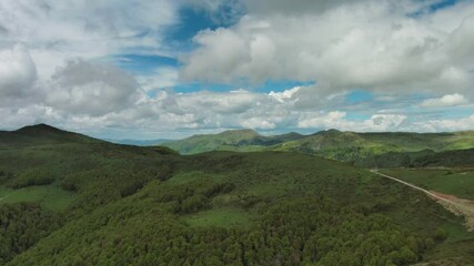 Wall Mural - aerial view of clouds over summer green mountains landscape, montenegro, 4k