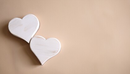 Wall Mural - couple of white wooden hearts on light beige background, copy space- 93206