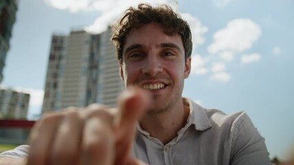 Pov happy Caucasian man using mobile phone smartphone typing message smiling laugh joyful male webcam addicted touch screen view display touchscreen cellphone gadget guy city chatting outdoor street