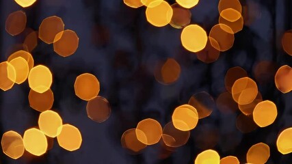 Aufkleber - Golden bokeh lights on dark background, festive and warm atmosphere concept