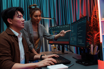 it developers discussing with point to intelligent website development coder system running data onl