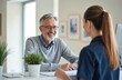 © miss irine - Mature bearded man consults with doctor in clinic. Patient talks with medical staff at reception desk in hospital. Healthcare concept, doctor giving advice, patient consulting with physician.