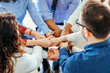© Dragana Gordic - Team Members United in a Group Handshake to Represent Partnership and Unity