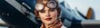 © Photography09 - Vintage female aviator with a silk scarf and goggles, posing beside a classic aircraft