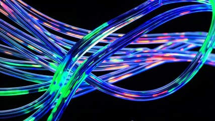 Leinwandbilder - Colorful fiber optic cables glowing vividly on black background. Digital technology concept