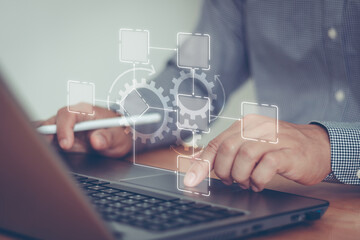 Business process automation workflow management of development innovation concept. Digital transformation software technology. Man use laptop with virtual gear flowchart, AI, artificial intelligence.