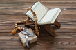 © Pixel-Shot - Koran, tasbih and gift box on wooden background. Ramadan celebration