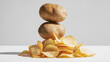 © Anoop - Whole brown potatoes paired with golden potato chips, blending earthy freshness and crisp savories in a rustic wholesome display of versatile potato goodness